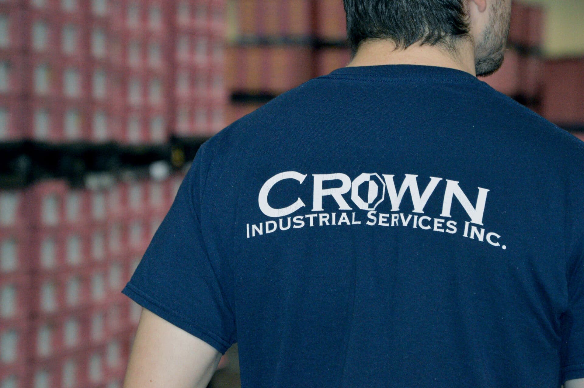 Crown Industrial Services employee wearing a company shirt