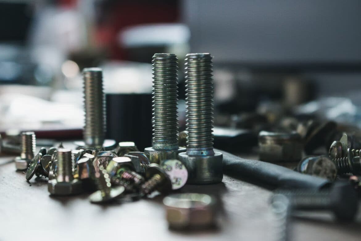 Assorted metal nuts, bolts, and threaded fasteners