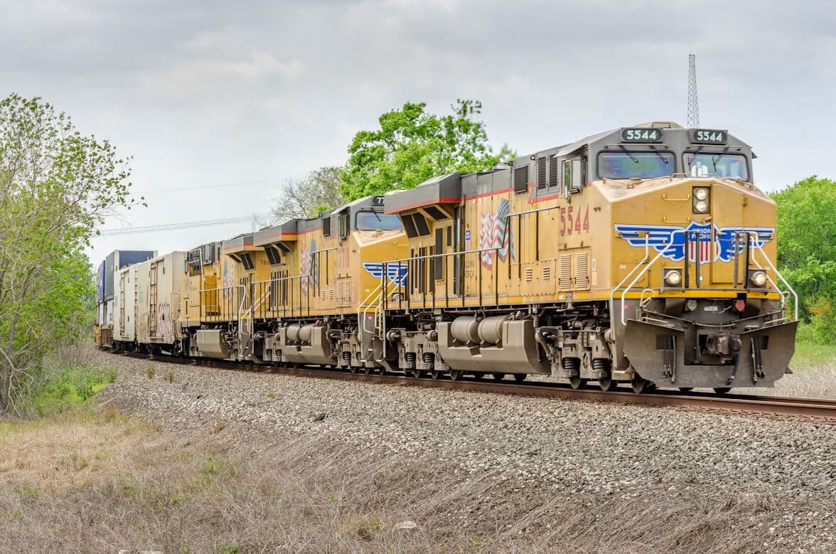 Freight locomotive traveling on railroad tracks
